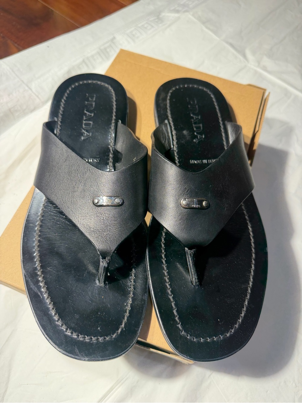 Prada Men’s Black Leather Thong Sandals with Metal Logo Accent